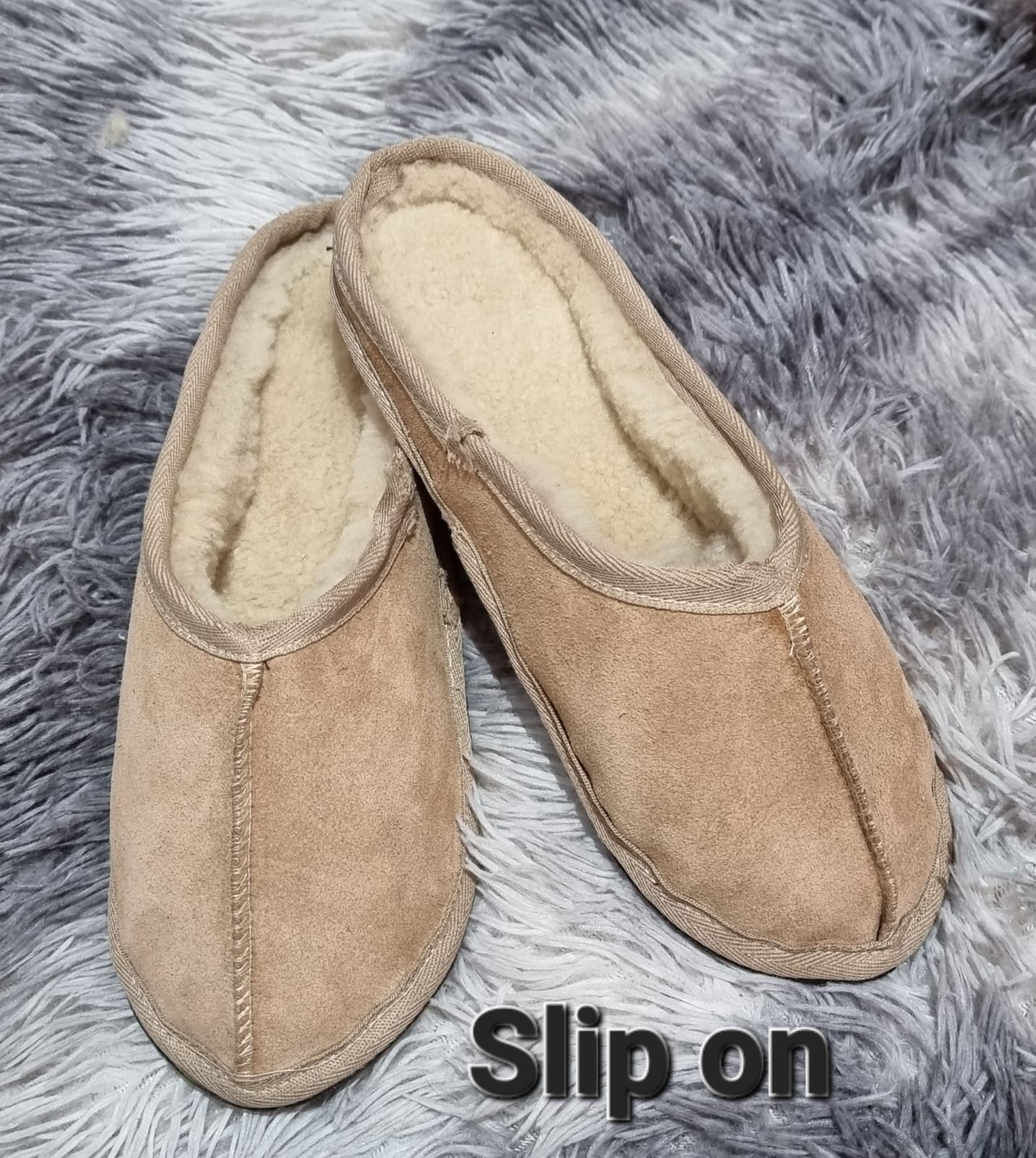 Genuine sheepskin slip-on slippers with rubber sole